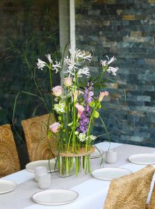 Modern airy wedding, event centerpiece, base with vials (purple, green, calla, rose, nerine, delphinium, lisianthus)