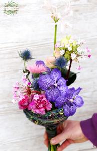 small orchid bouquet in bouquet holder base