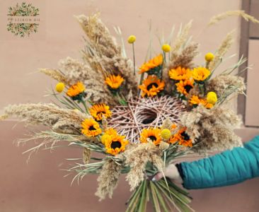 Modern bouquet with sunflowers and dried grasses
