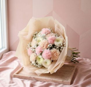 Round pink bouquet with plush balls, carnations, buttercups (10 stems + gypsophla)