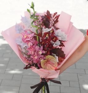 Pink orchid stems with anthurium