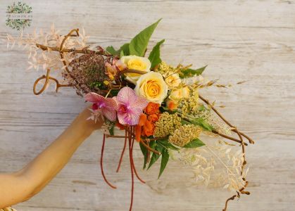 Small boat bouquet with orchids, twisting branches
