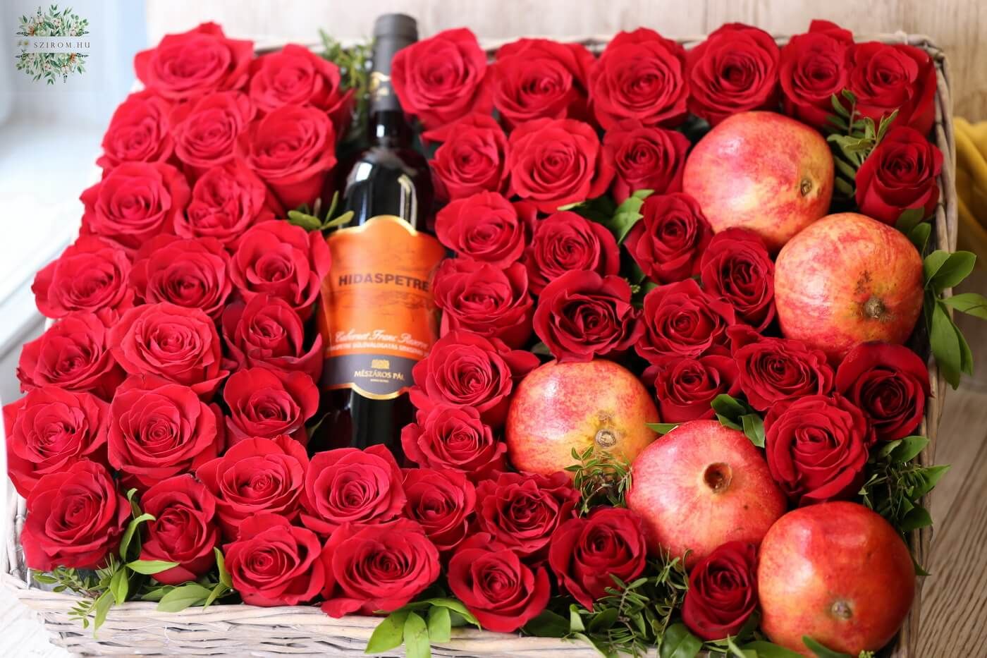 flower delivery Budapest - red whine in a bed of 50 roses, with pomegranate