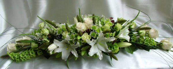 long arrangement of white - green flowers