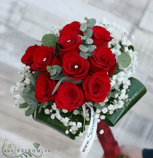 10 red roses in a tight round bouquet, with baby's breath and diamanté pins