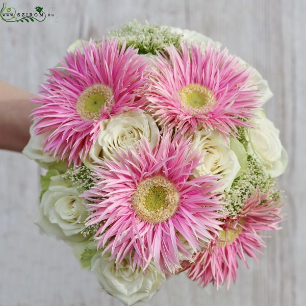 Bridal bouquet with white roses, pink spider gerberas