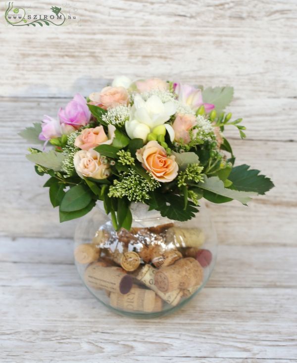 Glass ball with corks, pastel flower arrangement (spray rose, trachelium, freesia, pink, peach), wedding