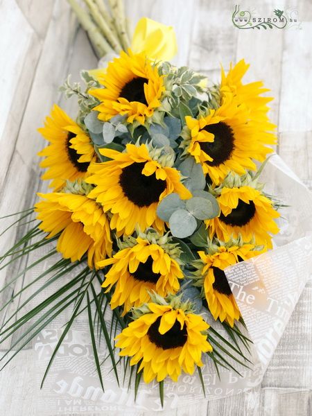 9 mini sunflowers in a long arrangement