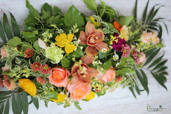 Main table centerpiece (meadow flowers, orchid, rose, carnation, santini, orange, yellow)