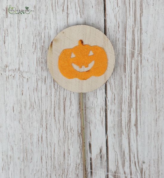 Happy pumpkin figure on stick