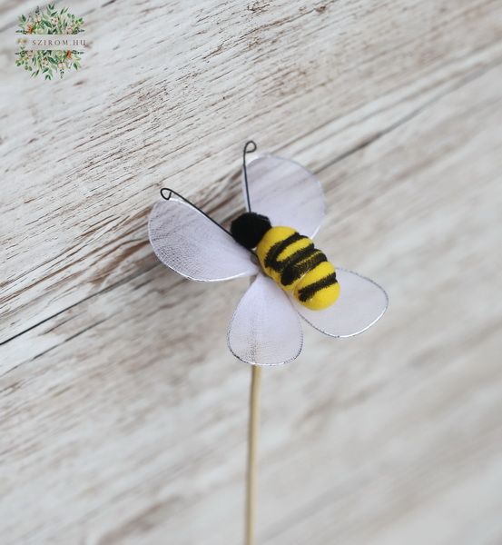 Bienenfigur auf einem Stock