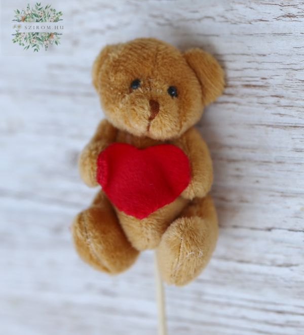 brauner Teddybär mit roter Herz an einem Stiele