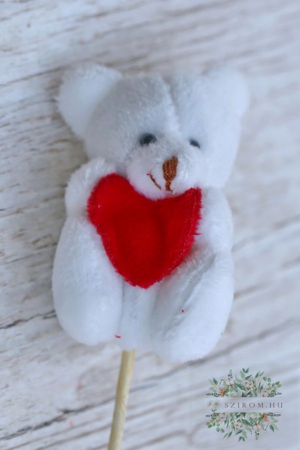 sticked white teddybear with a red heart