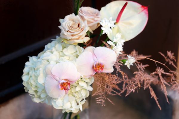 Airy bouquet with flamingo flower, orchids, with cylinder vase