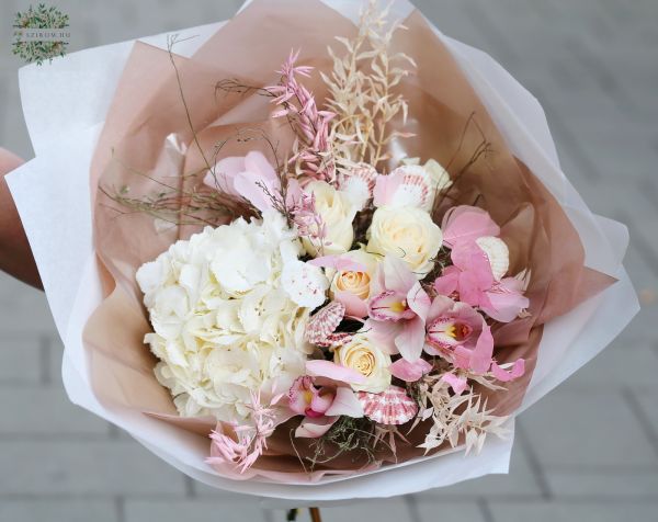 Pastel pink summer bouquet with seashells, orchids
