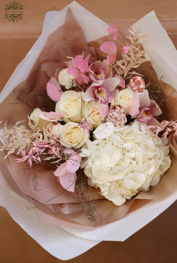 Pastel pink summer bouquet with seashells, orchids