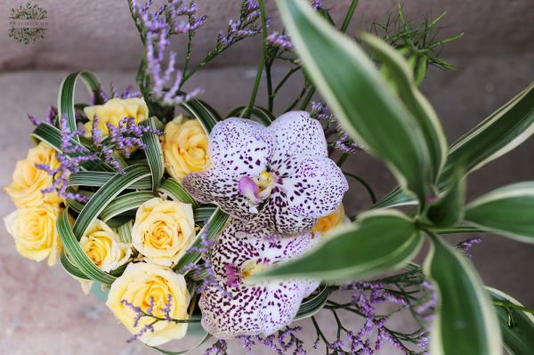 Small flower boat with vanda orchid, spray rose