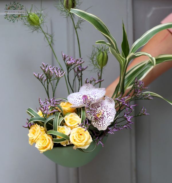 Small flower boat with vanda orchid, spray rose
