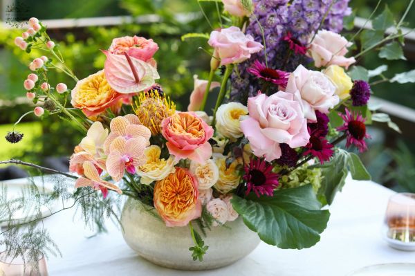 Romantic crescent moon shaped summer wedding centerpiece flower bowl (English rose, orchid, delphinium, calla, seasonal flowers, purple, peach)