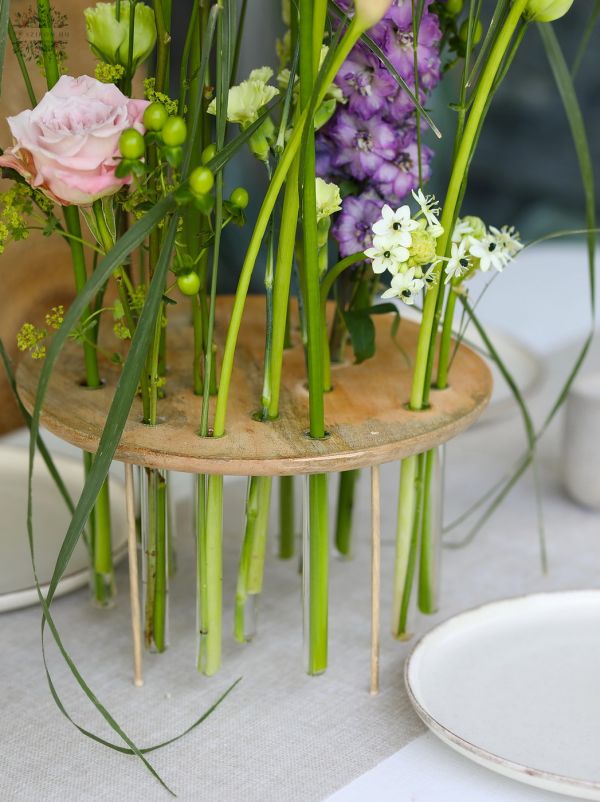 Modern airy wedding, event centerpiece, base with vials (purple, green, calla, rose, nerine, delphinium, lisianthus)