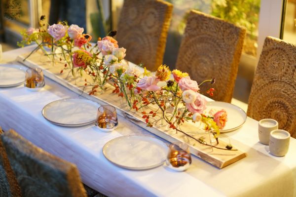 Modern wedding event centerpiece on wooden table (rosehip, lavender purple, orange, pastel yellow, English rose, leucospermum)
