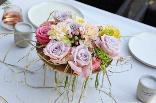 Modern wedding and event table decoration with pastel roses (lavender purple, pink, light yellow, rose, English rose, carnation, leucospermum)
