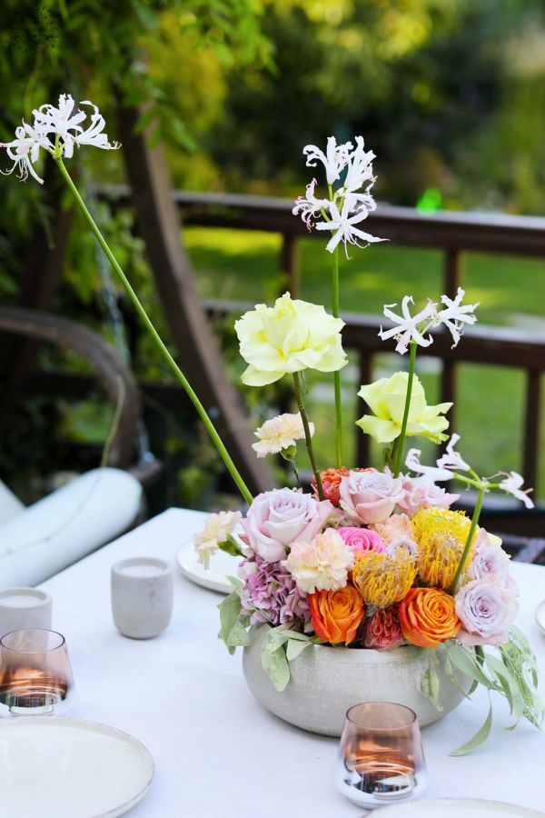 Modern floating table decoration for weddings and events (rose, English rose, leucospermum, carnation, yellow, orange, lavender, pink)