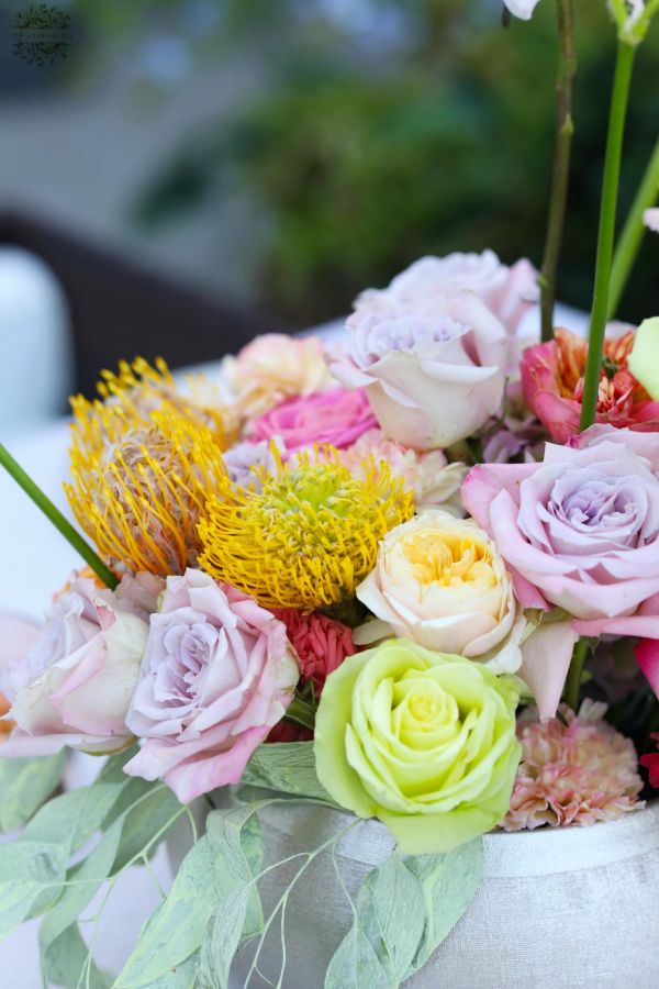 Modern floating table decoration for weddings and events (rose, English rose, leucospermum, carnation, yellow, orange, lavender, pink)