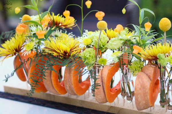 Modern wedding table decoration, event table decoration, autumn, made of pumpkins (chrysanthemum, sandersonia, lisianthus,  yellow, green)