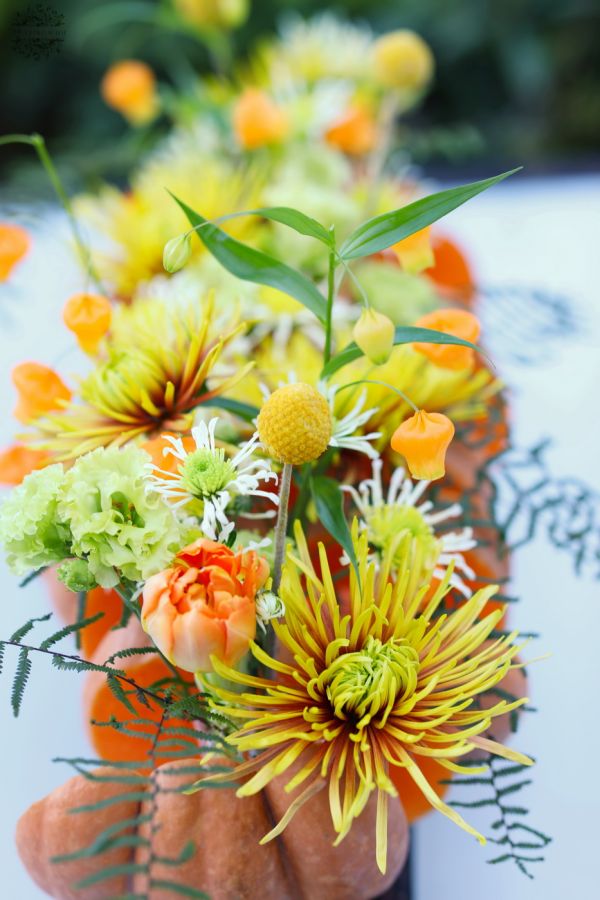 Modern wedding table decoration, event table decoration, autumn, made of pumpkins (chrysanthemum, sandersonia, lisianthus,  yellow, green)