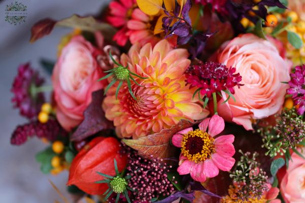 Autumn bridal bouquet with dahlias (rose, dahlia, zinnia, scabiosa, skimmia, orange, burgundy)