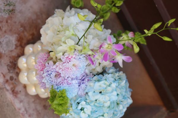 Pearlescent vase with hydrangea and orchid