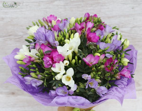 30 freesias in a round bouquet