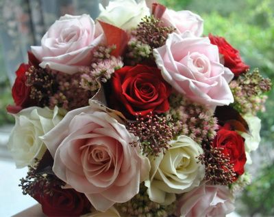 15 red, pink, white  roses with small flowers
