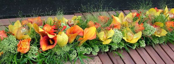 Main table centerpiece (calla, cymbidium, rose, crocosima, orange, yellow), wedding