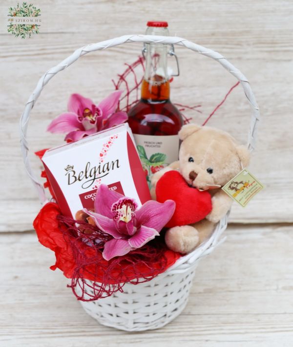 Geschenkkorb mit Pralinen. mit Teddybär, Wein, Orchidee