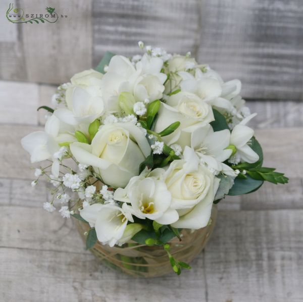 Centerpiece glass cube with white roses and freesias, wedding