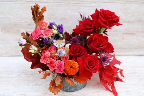 Autumn flower bowl with red roses