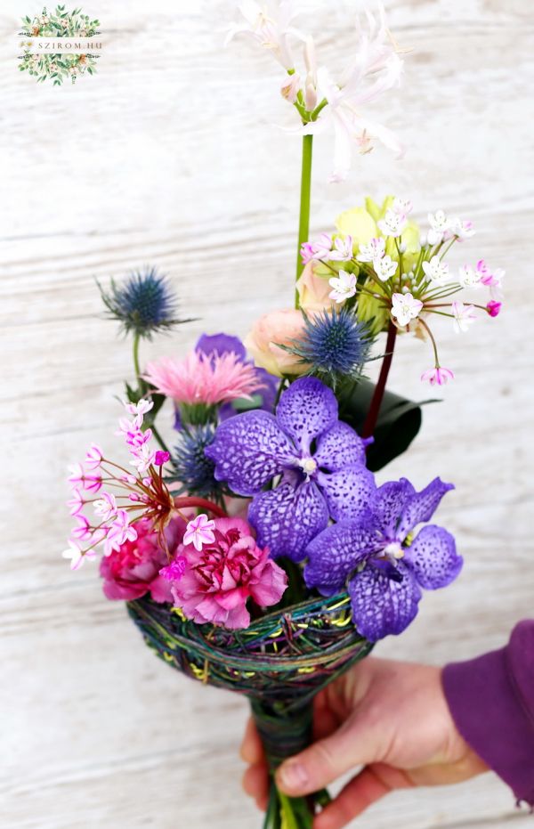 small orchid bouquet in bouquet holder base