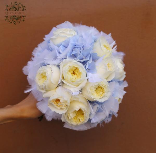 bridal bouquet with feathers made of English roses and hydrangeas