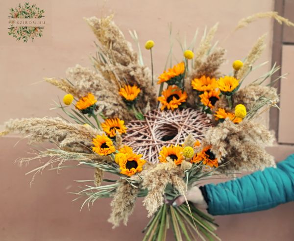 Modern bouquet with sunflowers and dried grasses