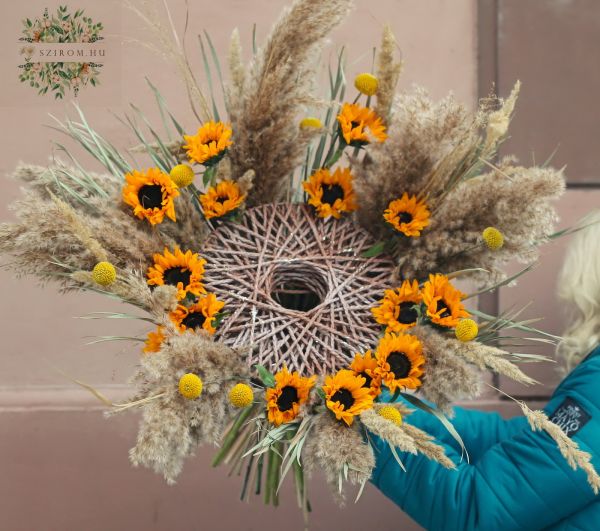 Modern bouquet with sunflowers and dried grasses