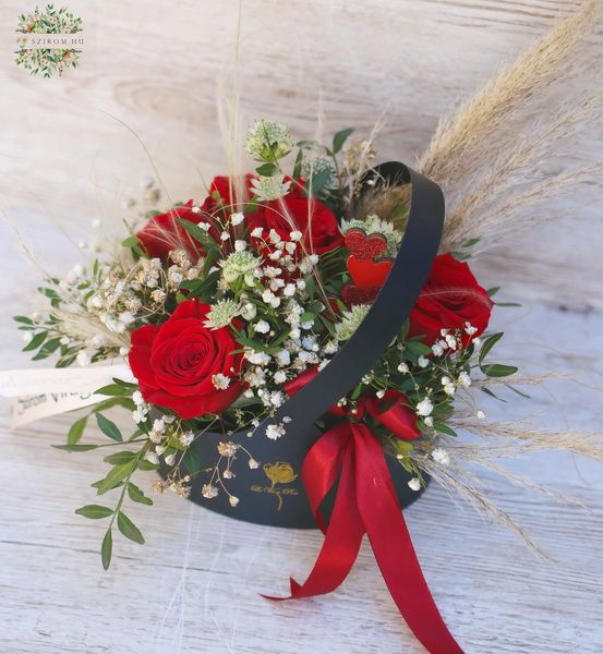 Oval flowerbag with 5 red roses and small flowers