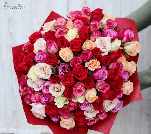 flower delivery Budapest - 90 stems of red, pink, purple, white roses in a round bouquet