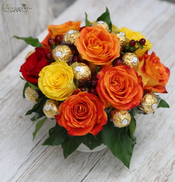 flower delivery Budapest - Ceramic pot with warm color roses, and chocolate balls (9 stems)