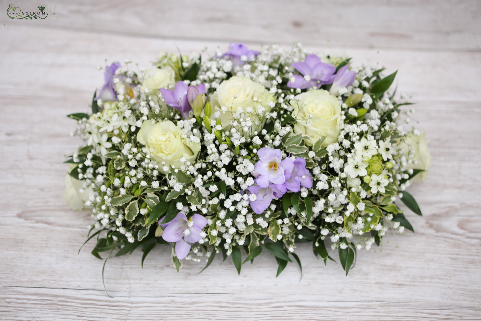 flower delivery Budapest - Oval table decoration (babybreath, freesia, rose, white, purple)