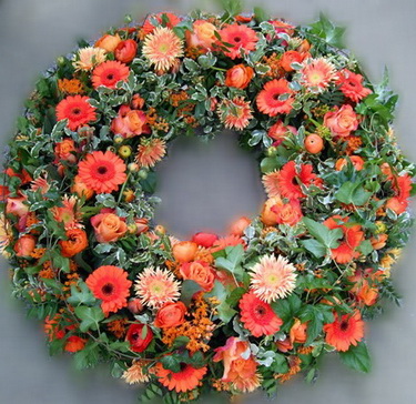 flower delivery Budapest - wreath with 100 orange flowers (65 cm)