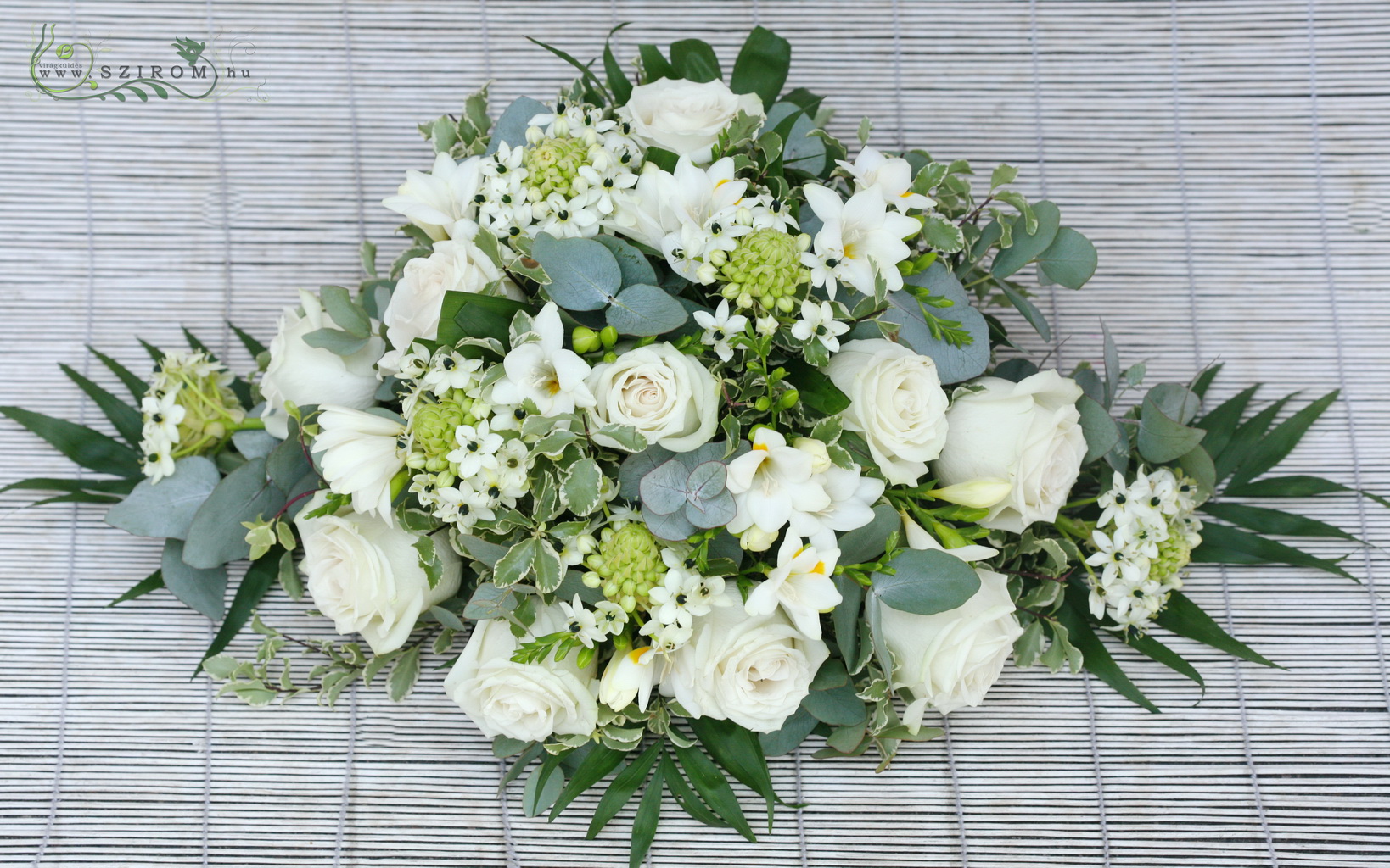 flower delivery Budapest - oval car flower arrangement with roses, ornithogalums, freesias