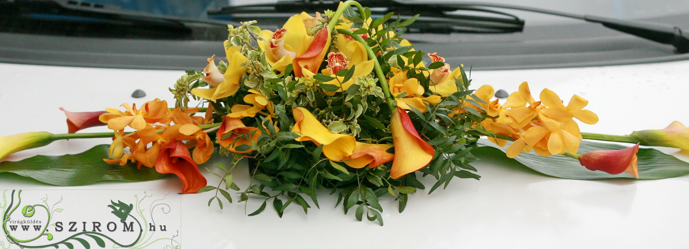flower delivery Budapest - oval car flower arrangement with orchids (cala, orange, yellow)
