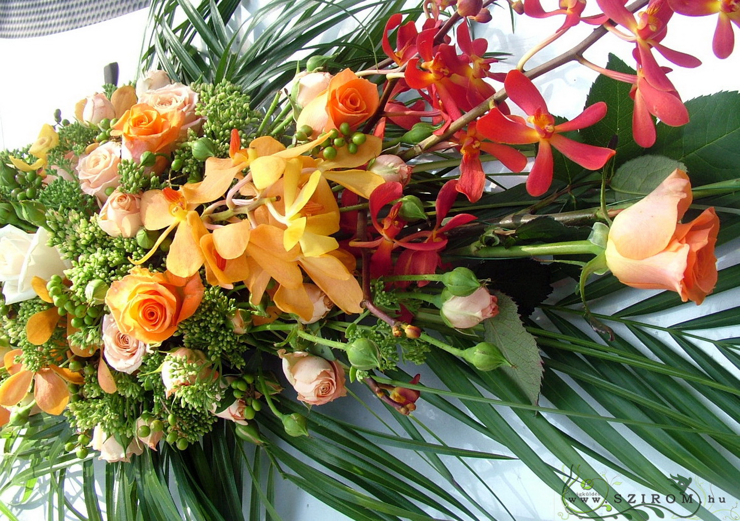 flower delivery Budapest - oval car flower arrangement with orchids (rose, orange, peach)